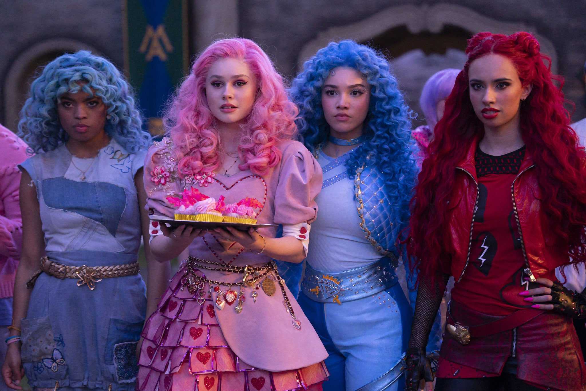 Cinderella, Bridget, Chloe and Red stand in The Merlin Academy quad in Descendants: The Rise of Red.