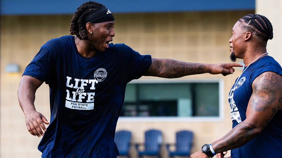 Penn State Nittany Lions defensive lineman Ikenna Ezeogu jokes around with a teammate during the 23rd annual Lift for Life.
