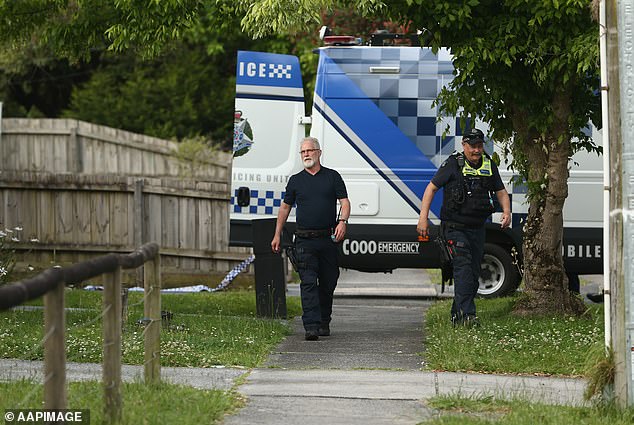 Police attend the bloody crime scene in Bayswater
