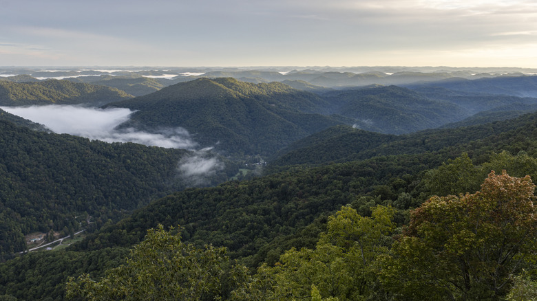 Morning fog drifting over rolling green hills at Kingdom Come State Park in Harlan County, Kentucky