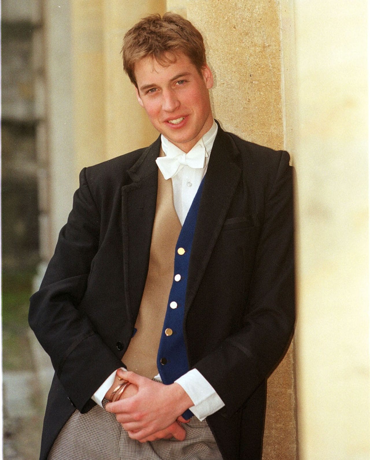 A portrait of Prince William wearing the Eton school dress of a black tail coat together with a stiff wing collar and white tie released on June 17 2000