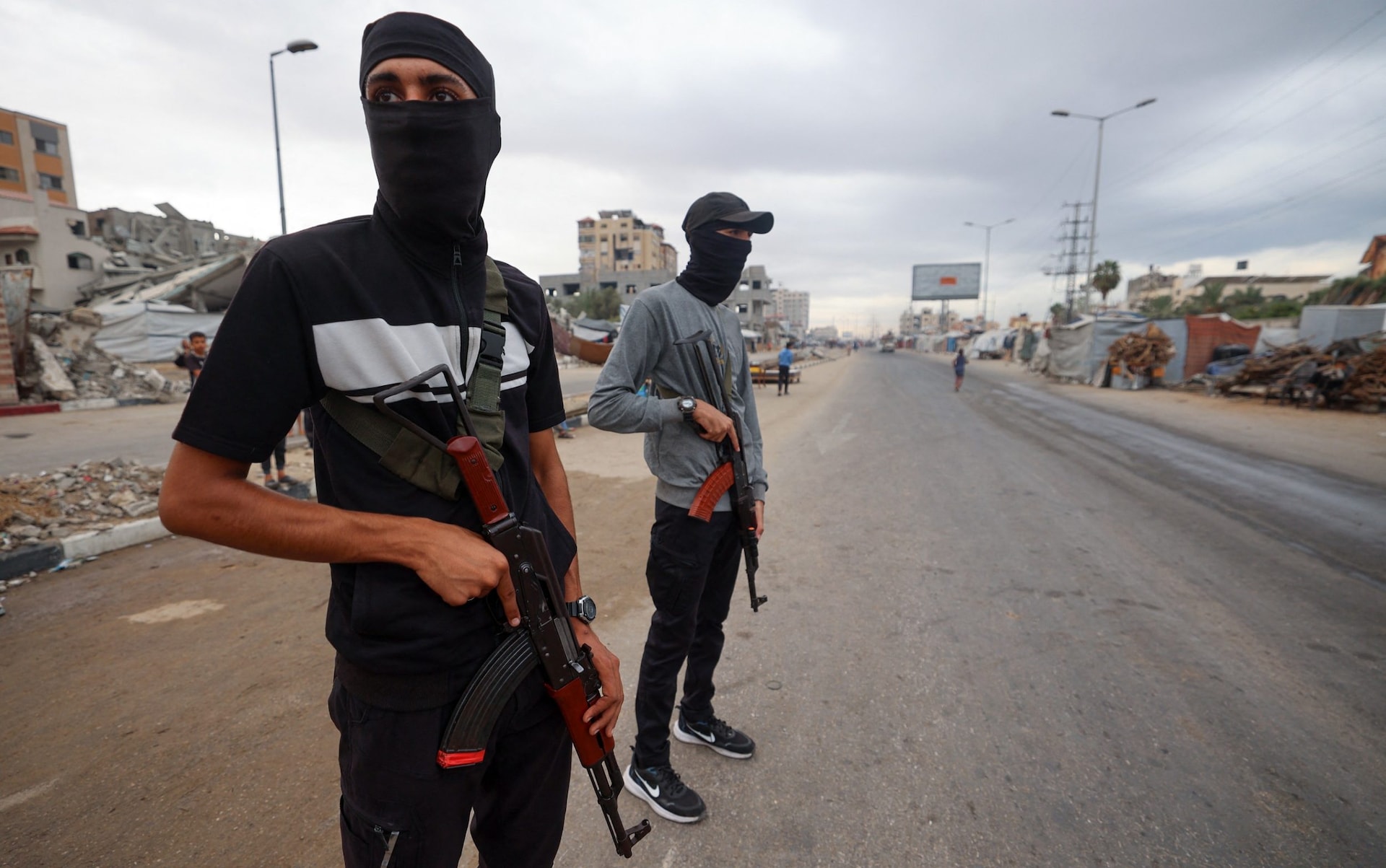 Members of the internal security forces loyal to the Palestinian group Hamas, man a checkpoint in the Nuseirat refugee camp in the central Gaza Strip, on October 12, 2025