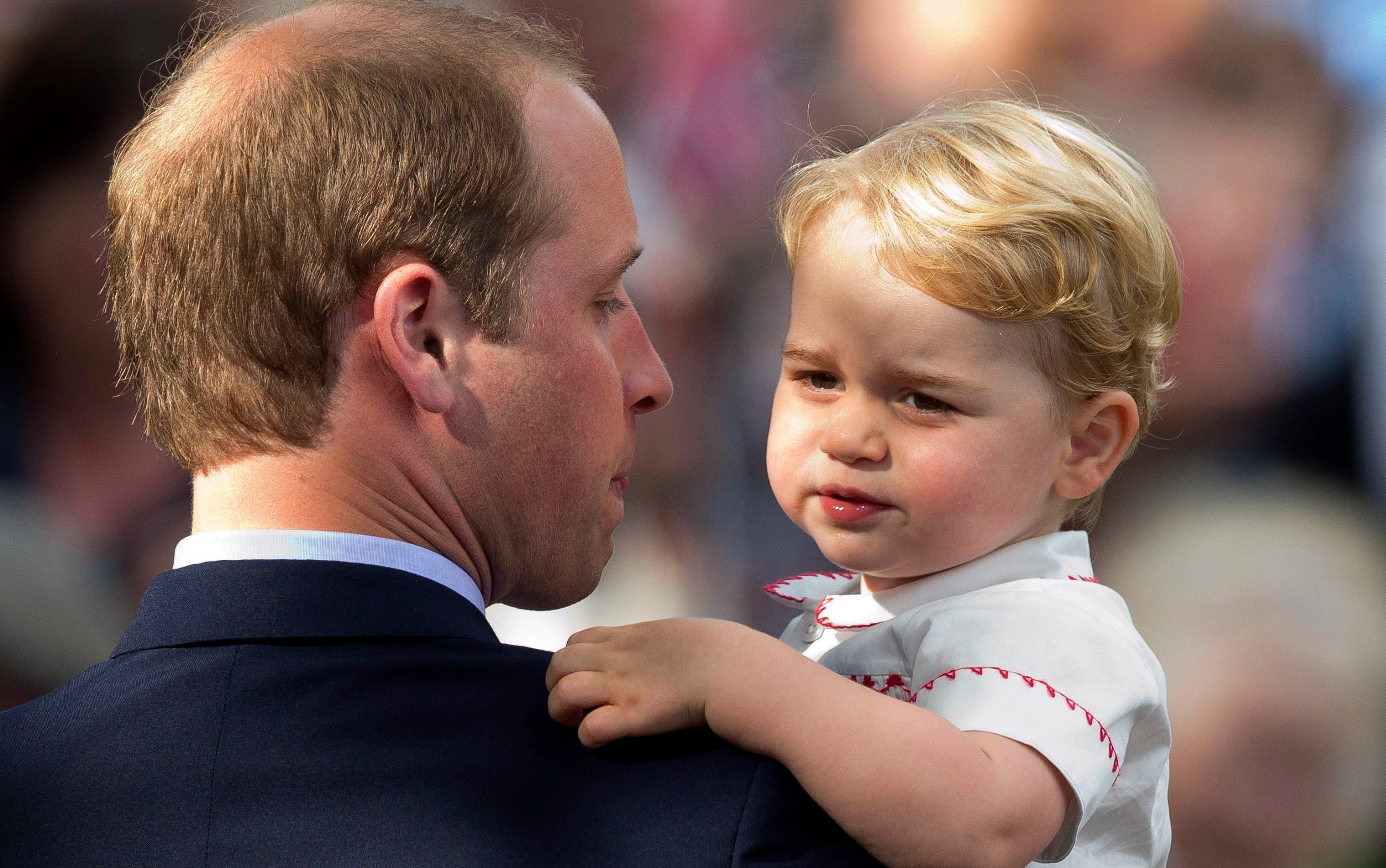 Prince William holding a young Prince George July 5 2015
