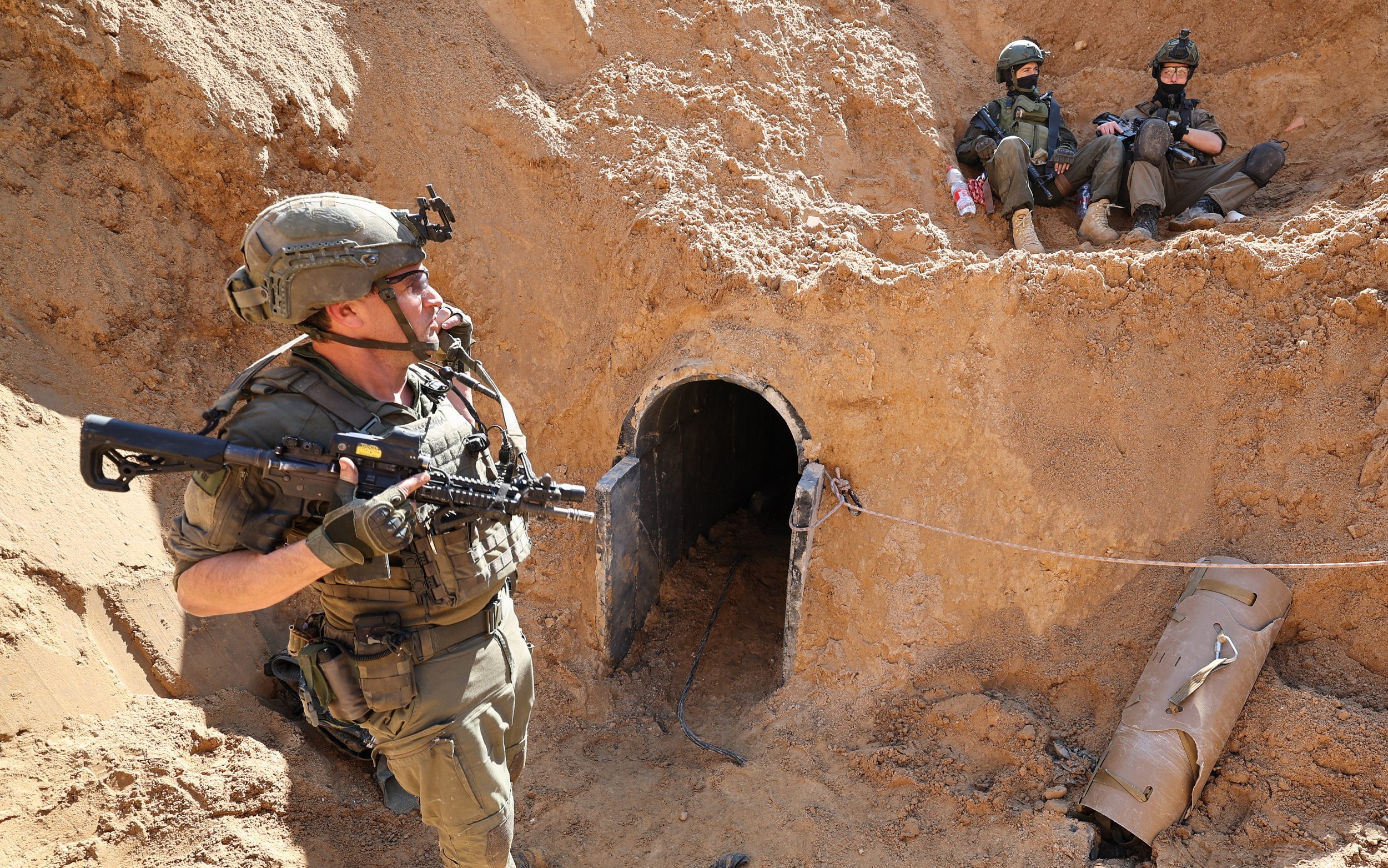 Israeli soldiers at the entrance of a tunnel outside the compound of the United Nations Relief and Works Agency for Palestine Refugees (UNRWA) in Gaza City
