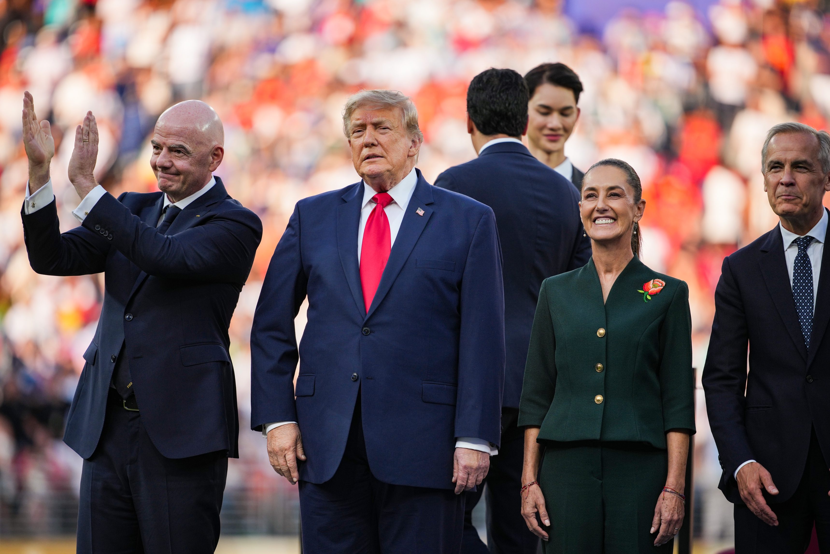 President Gianni Infantino, U.S. President Donald Trump, Mexican President Claudia Sheinbaum, and Canadian Prime Minister Mark Carney look on during the awards ceremony after the FIFA World Cup 2026... (Photo by Andrew Harnik/Getty Images)
