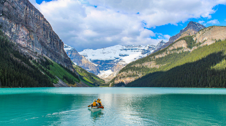 A man in a canoe amid Lake Louise at Banff