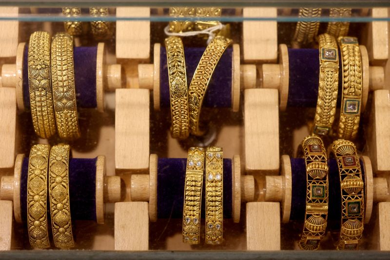 FILE PHOTO: Gold bangles are displayed inside a jewellery store