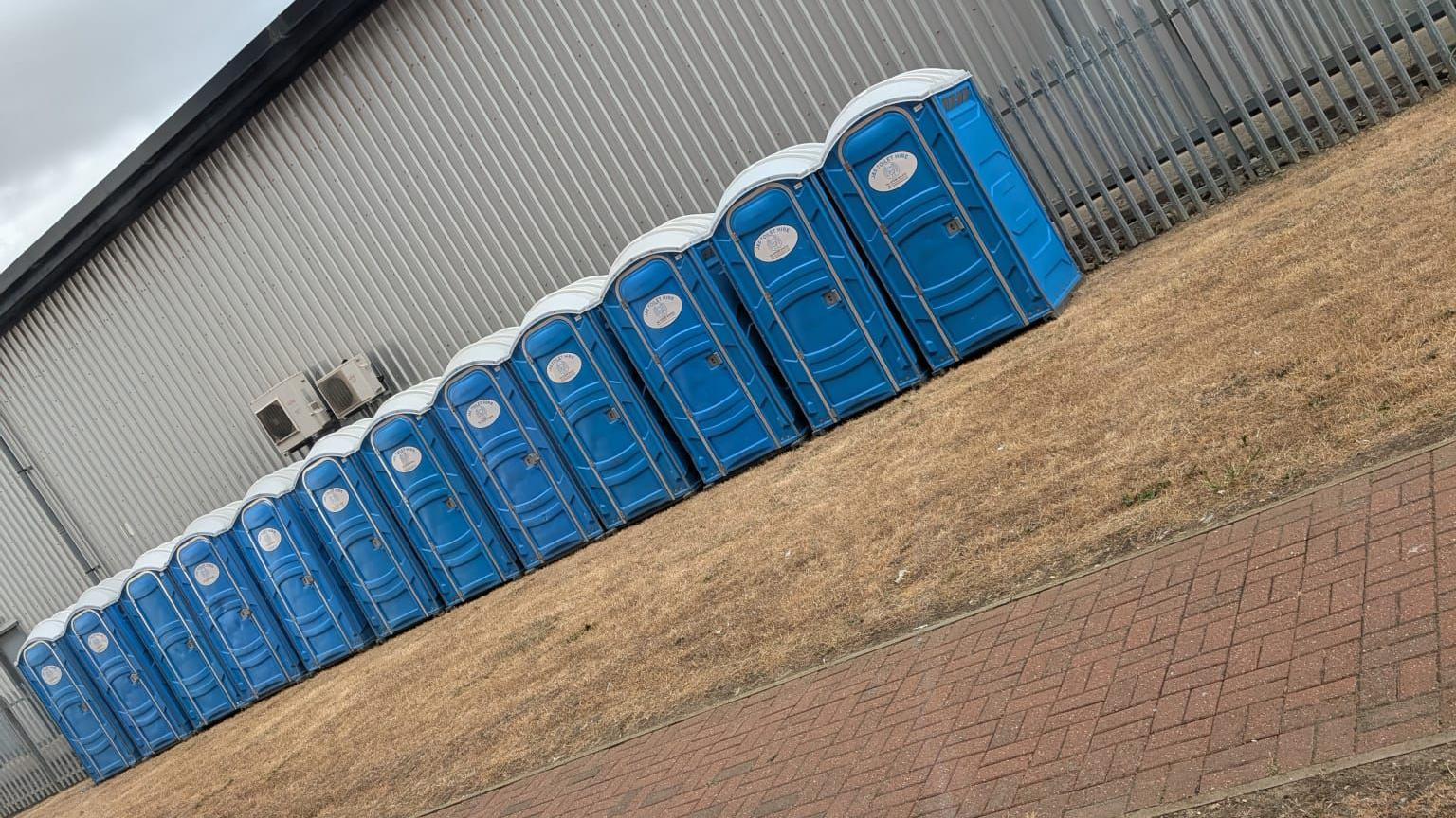 A row of portable toilets were delivered to Varity House in Peterborough
