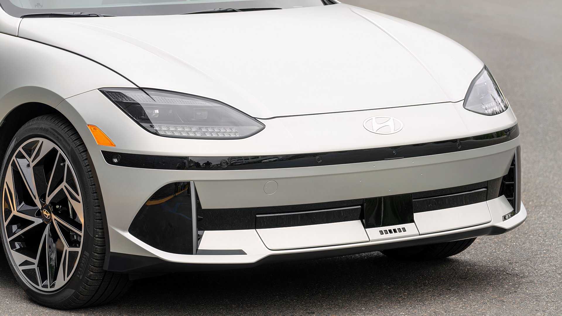 Close-up detail shot of a gray 2025 Hyundai Ioniq 6 showing the lower front fascia