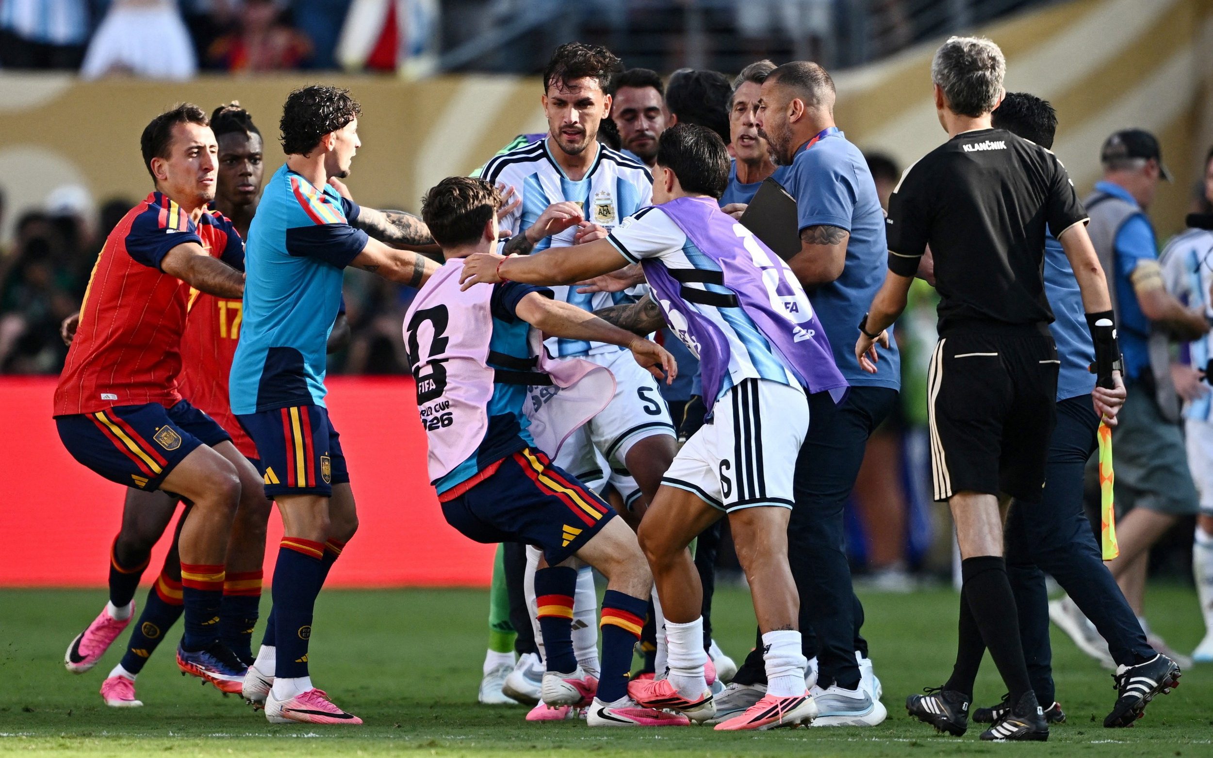 Spain v Argentina - New York/New Jersey Stadium, East Rutherford, New Jersey, U.S. - July 19, 2026 Argentina's Leandro Paredes and Lisandro Martinez clash with Spain's Gavi after the match