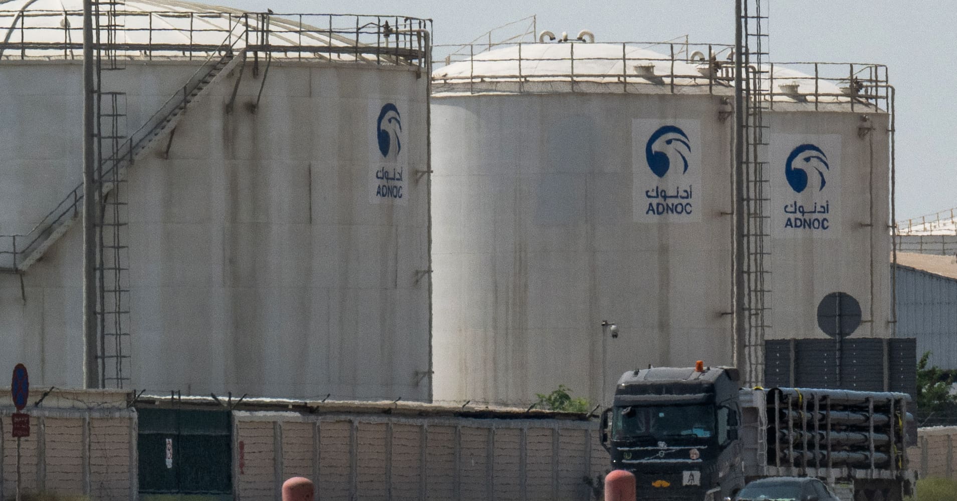 A truck drives past an ADNOC Gas a subsidiary of the Abu Dhabi National Oil Company facility in Abu Dhabi on March 3, 2026.