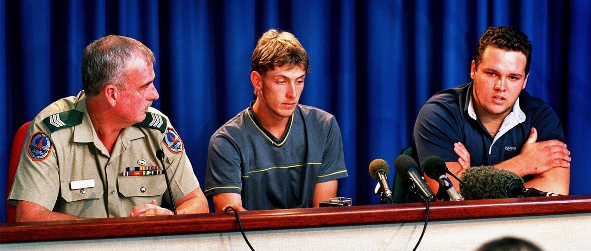 Survivors of a Northern Territory Crocodile attack Ashely McGough (C) and Shaun Blowers (R) and Senior Sergeant Garry Casey (L)