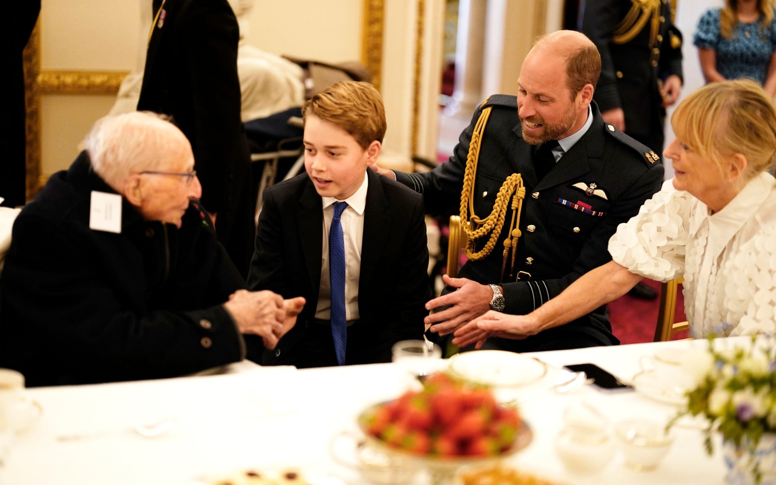 Prince William and Prince George join Second World War veterans at a tea party in Buckingham Palace following the military procession to mark the 80th anniversary of VE Day on May 5 2025