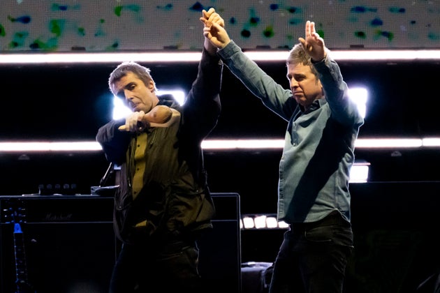 Liam and Noel Gallagher of Oasis on stage in August 2025