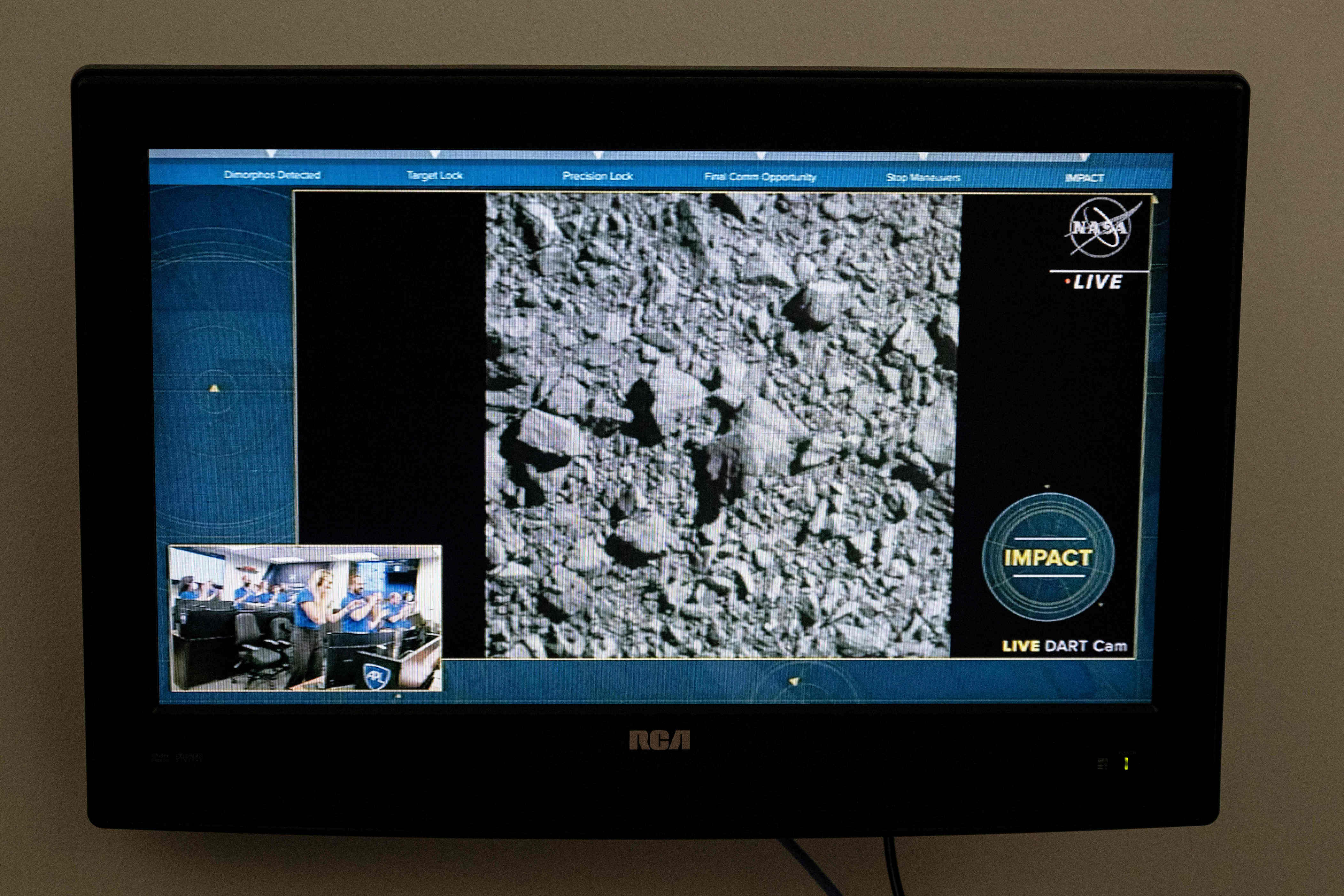 A TV at Nasa’s Kennedy Space Center in Cape Canaveral shows the final images from the Dart test (AFP/Getty)