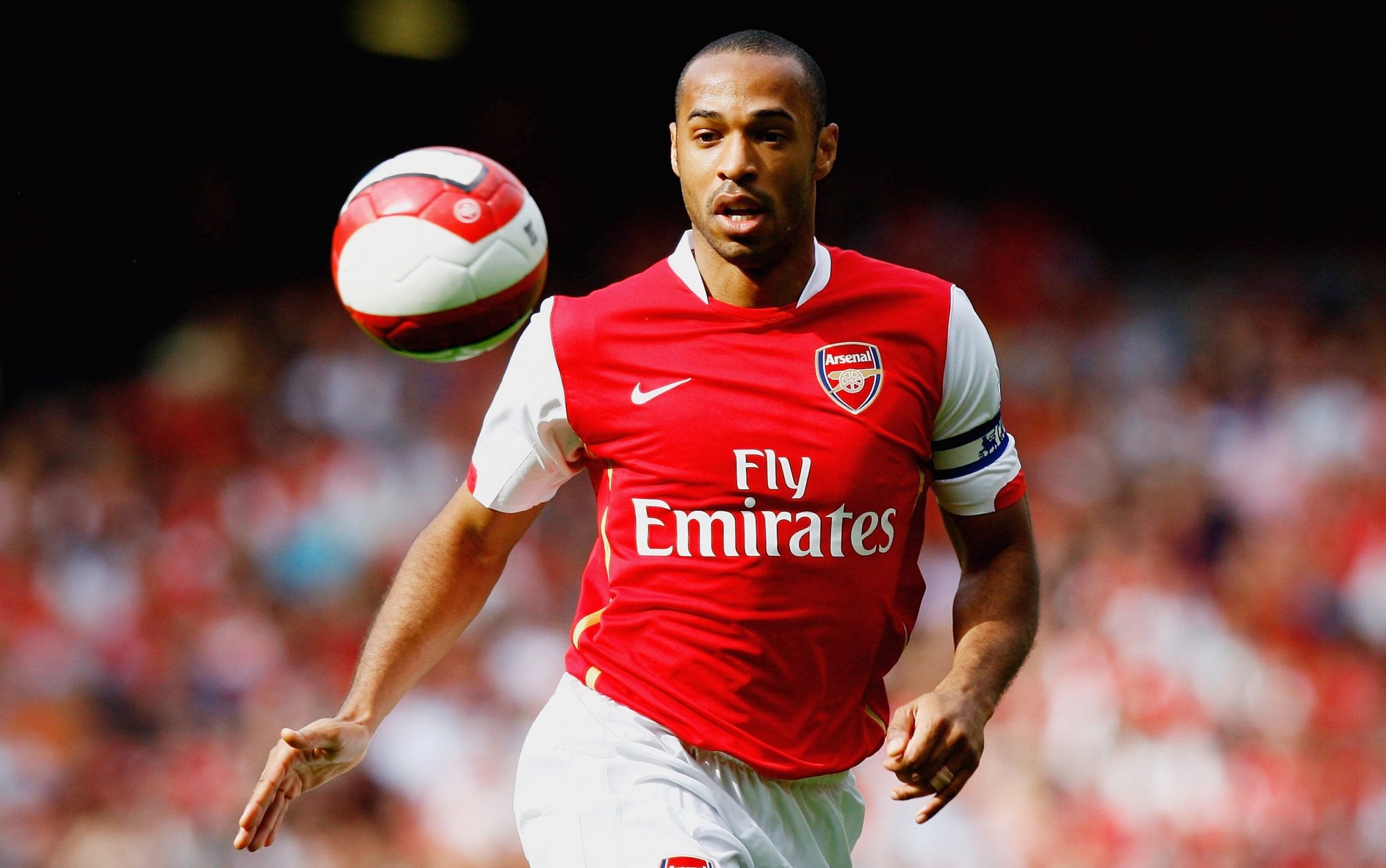 Thierry Henry sports Arsenal's 2006-07 home kit, the first version after Emirates took over front-of-shirt sponsor rights from O2