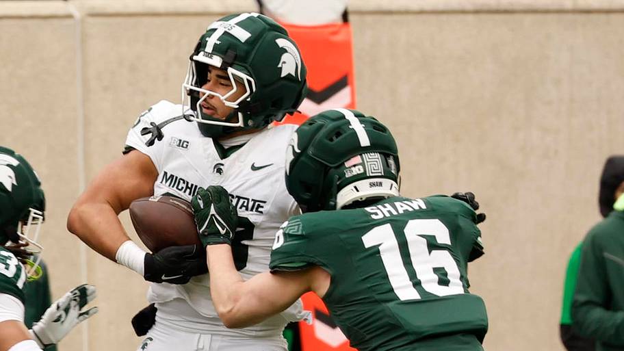 Michigan State Spartans tight end Kai Rios (88) runs with the ball as linebacker Adam Shaw (16) closes in