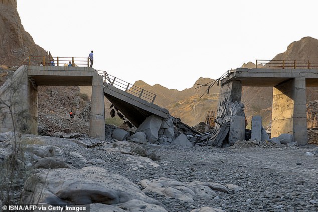 A heavily-damaged bridge which was hit by a US strike is pictured along the road connecting Roudan and Bandar Abbas in southern Iran on July 18