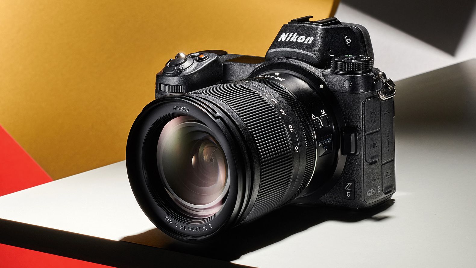 Nikon Z6 product image on a yellow, red, and grey background
