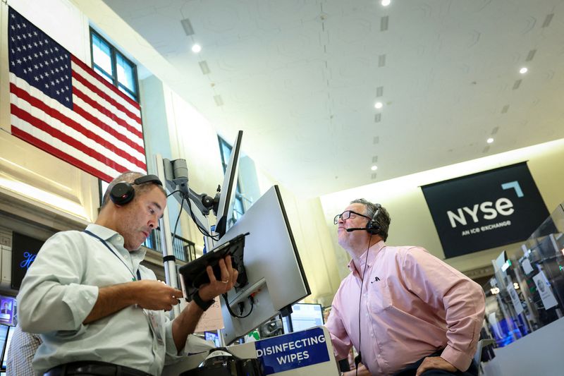 Traders work on the floor of the NYSE in New York