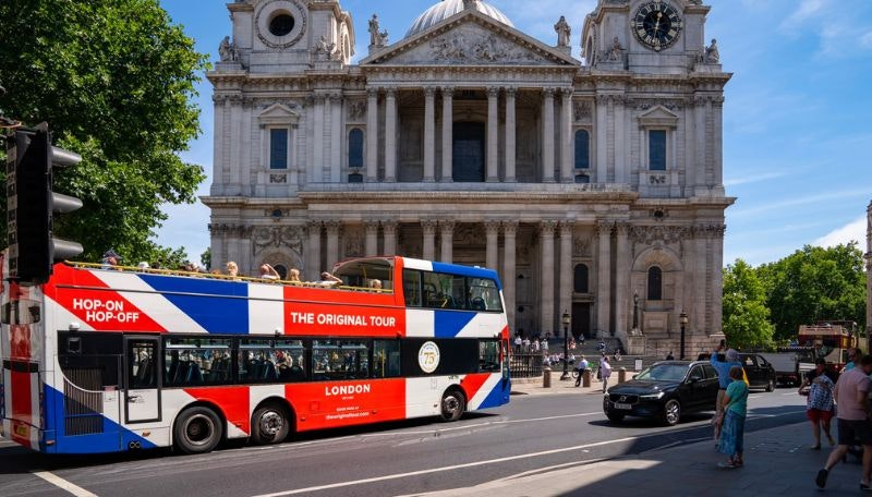 An Original Tour bus in front of a London landmark