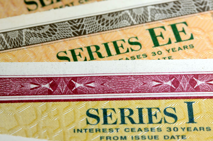 A fanned series of paper Treasury bonds.
