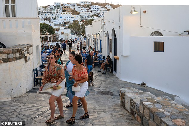 Tourists walking the streets of Astypalaia, the Greek island struggling the most with recent water shortages