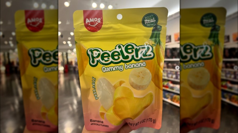 Hand holding up a bag of Gummy Banana Peelerz