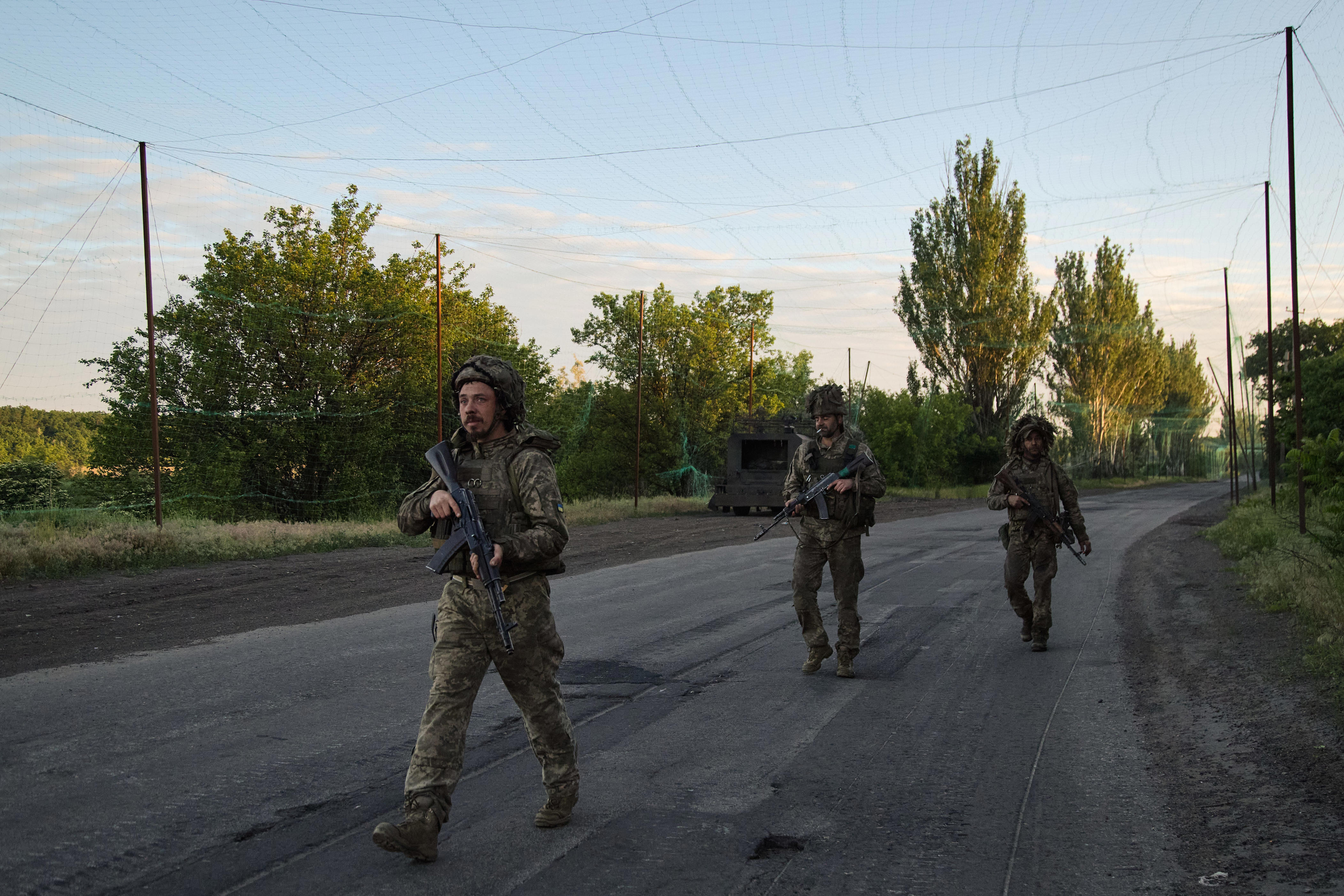 Servicemen of the Armed Forces of Ukraine secure a frontline road after detecting a Russian FPV drone in the Donetsk region on May 27, 2026, in Donetsk, Ukraine.