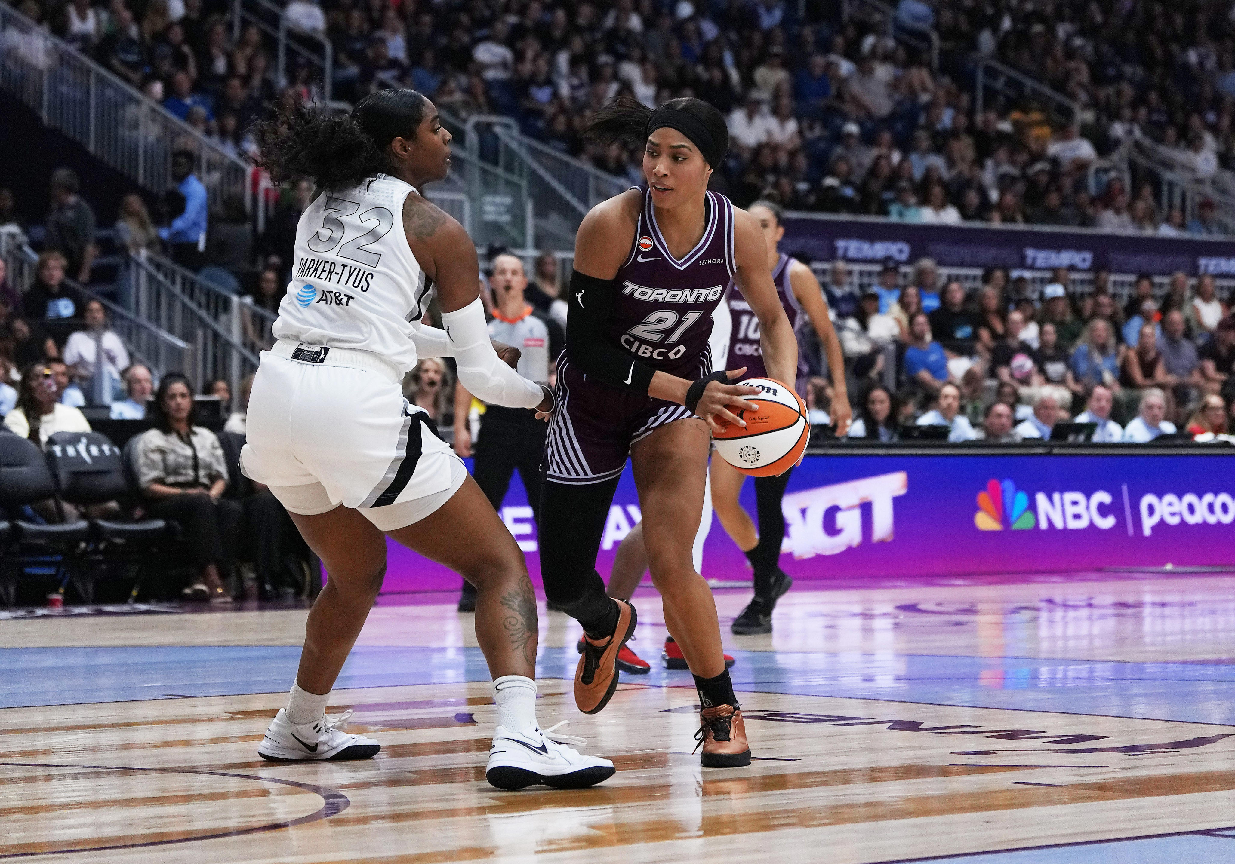 July 20, 2026; Toronto, Ontario, Canada; Toronto Tempo forward Isabelle Harrison (21) controls the ball as Las Vegas Aces forward Cheyenne Parker-Tyus (32) tries to defend during the fourth quarter at Coca-Cola Coliseum.