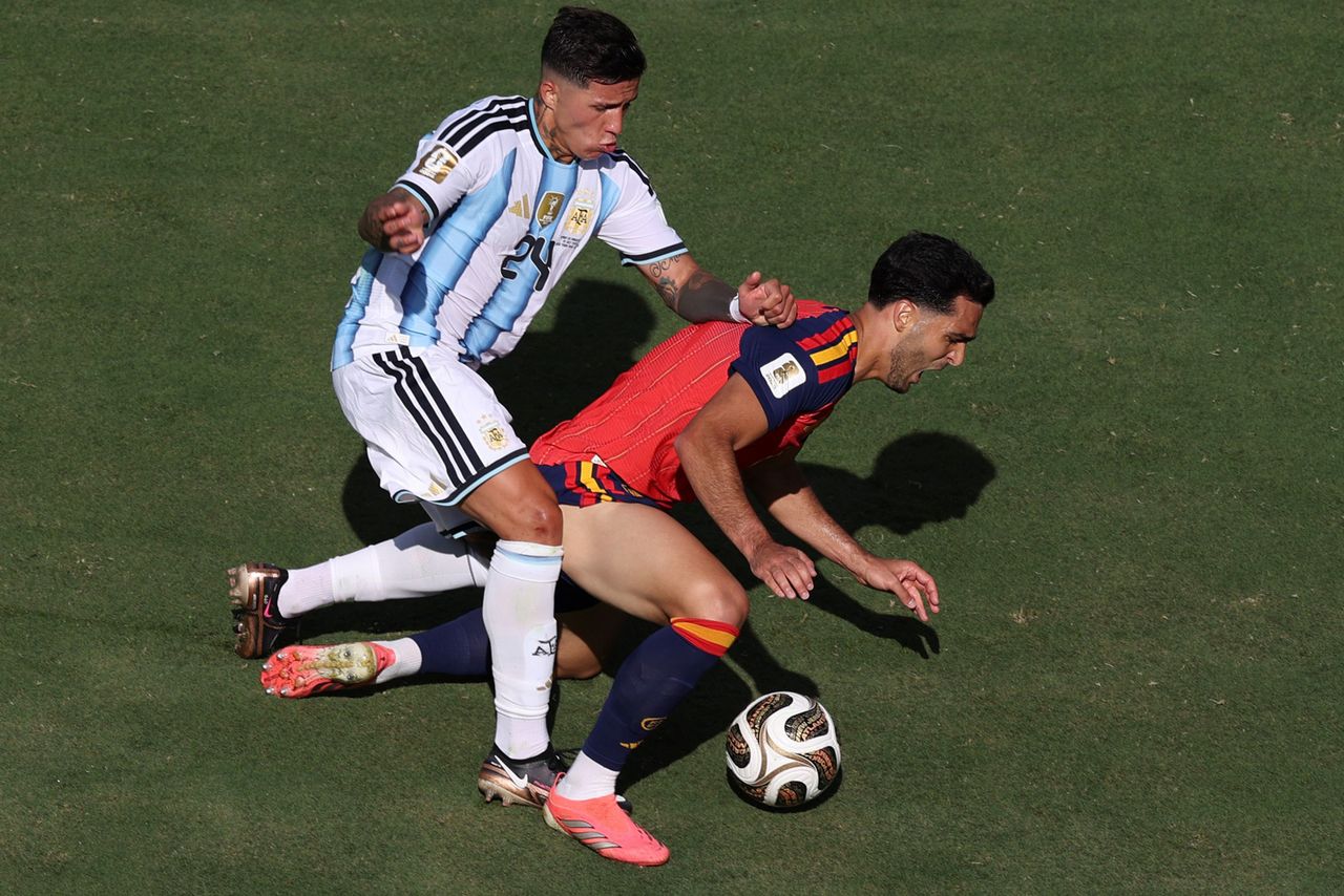 Mikel Merino R of Spain competes with Argentina's Enzo Fernandez during the final match between Spain and Argentina at the 2026 FIFA World Cup