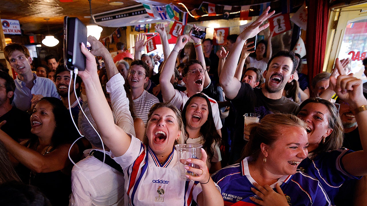 France fans celebrate after their team won the 2026 World Cup match between France and Sweden in the Brooklyn borough of New York City, on June 30, 2026.