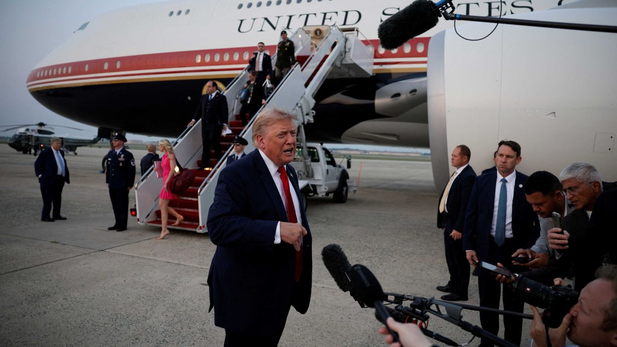 U.S. President Donald Trump speaks with the media as he arrives at Joint Base Andrews in Maryland, U.S., July 19, 2026. REUTERS/Evan Vucci