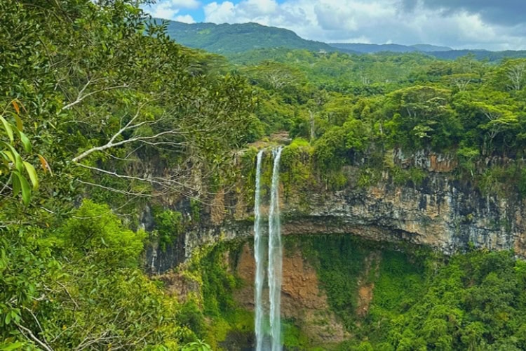 Chamarel Waterfall in Mauritius surrounded by lush greenery