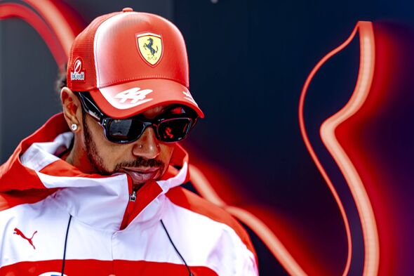 Lewis Hamilton cleared after hitting Ferrari mechanic during pit stop