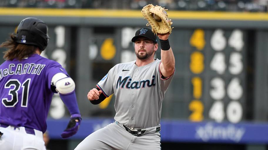 Miami Marlins first baseman Liam Hicks catches a throw.