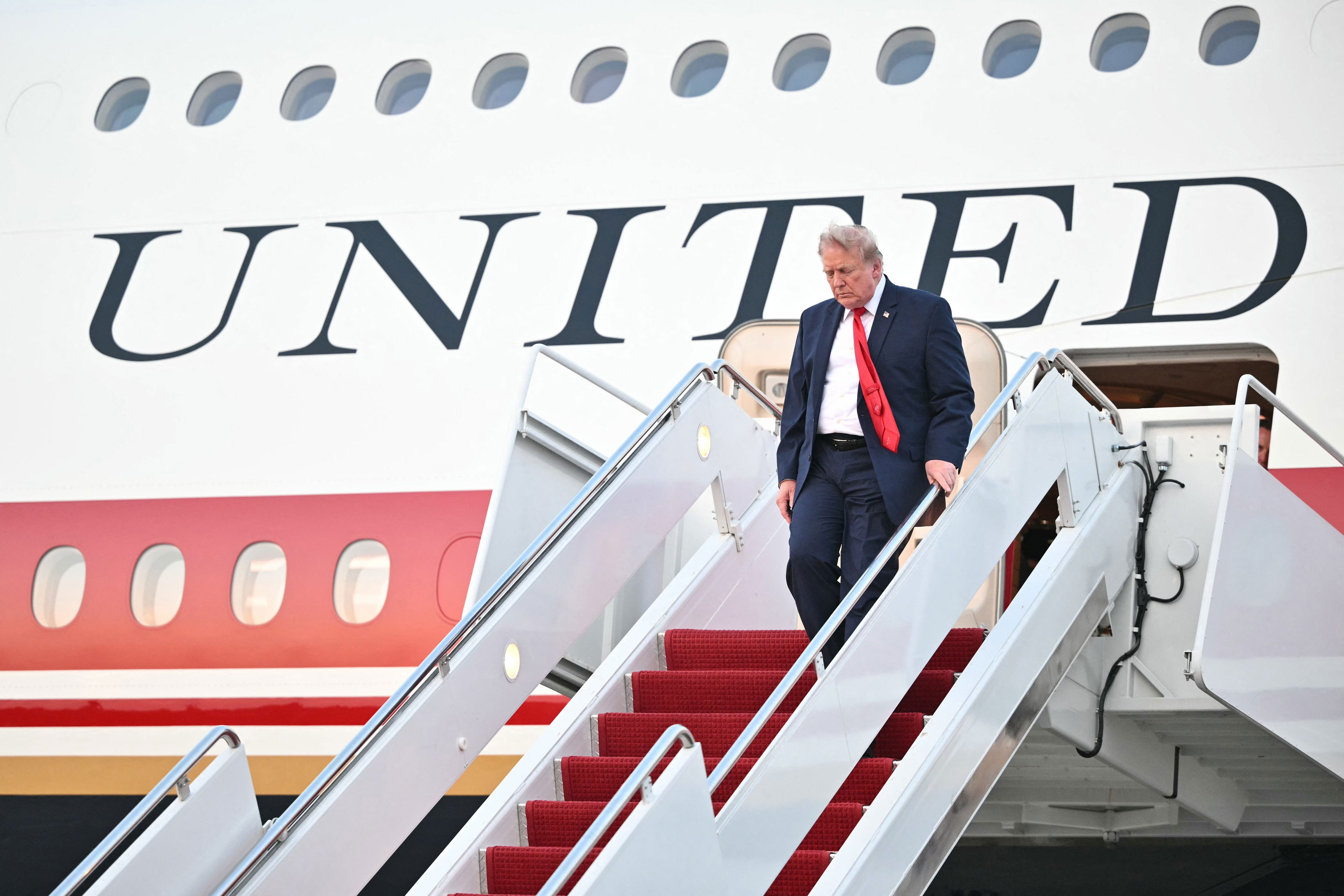 US President Donald Trump steps off Air Force One upon arrival at Joint Base Andrews in Maryland on July 19, 2026. Trump is returning to the White House from New Jersey, where he attended the 2026 World Cup Final. (Photo by Mandel NGAN / AFP via Getty Images) (Photo: MANDEL NGAN via Getty Images)