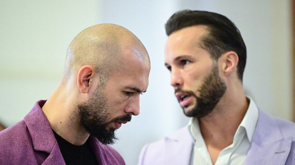 Andrew Tate, left, and his brother Tristan Tate, right, are pictured inside The Court of Appeal in Bucharest, Romania, on December 10, 2024. - Daniel Mihailescu/AFP/Getty Images/File