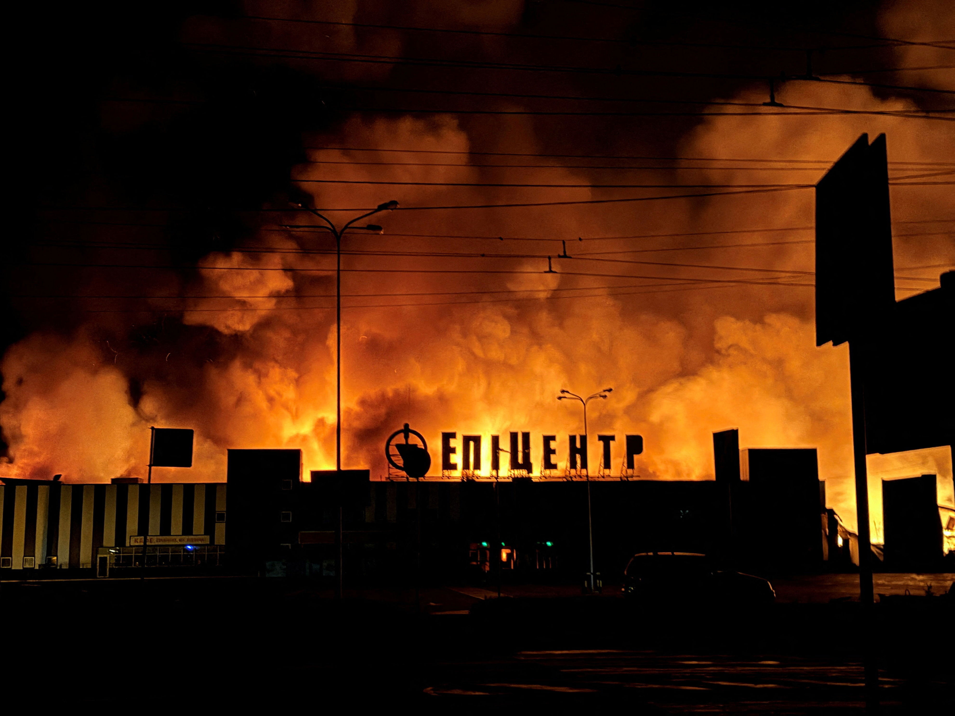 Smoke rises from a household item shopping mall which was hit by a Russian drone strike (Reuters)