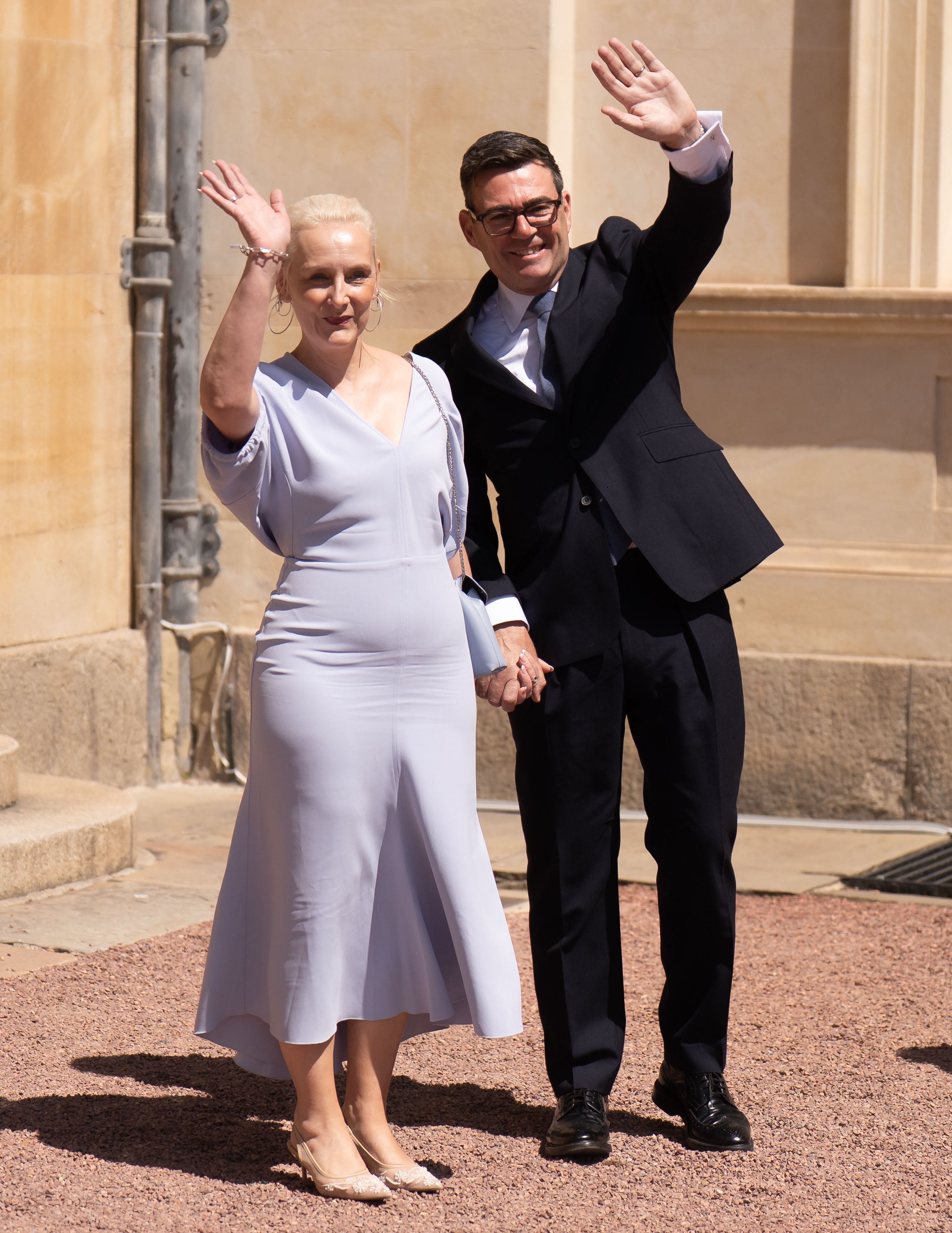 The couple wave after Mr Burnham’s audience with the King (PA Wire)