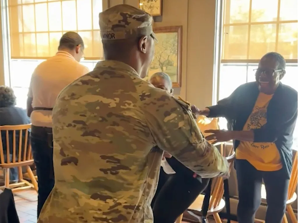 Soldier Emanuel approaches his surprised veteran mom, Laura, during her birthday meal at a Cracker Barrel restaurant.