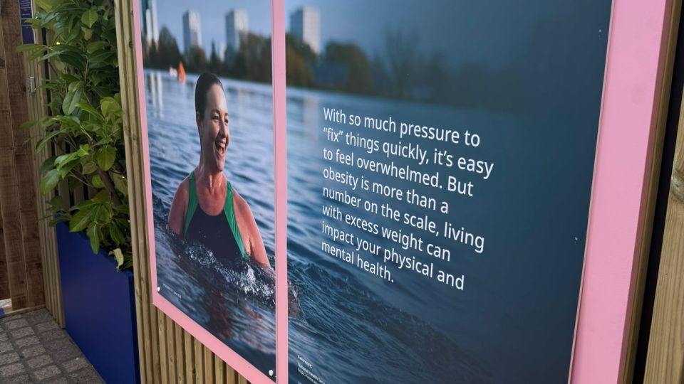 An information board on obesity in Novo Nordisk's maze exhibition in London, July 2026 - CNN