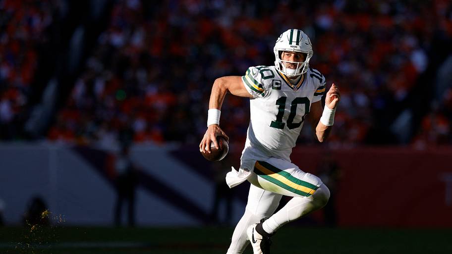 Green Bay Packers quarterback Jordan Love (10) runs the ball during the game at Denver.