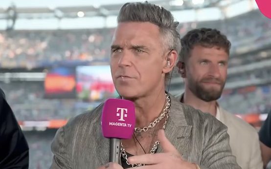 A white substance fell from Robbie Williams's mouth during an interview after the World Cup final