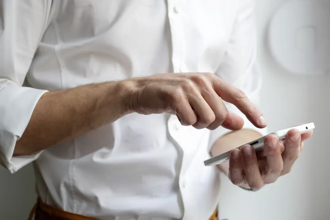 1. Checking your phone during conversations (Image Credits: Unsplash)