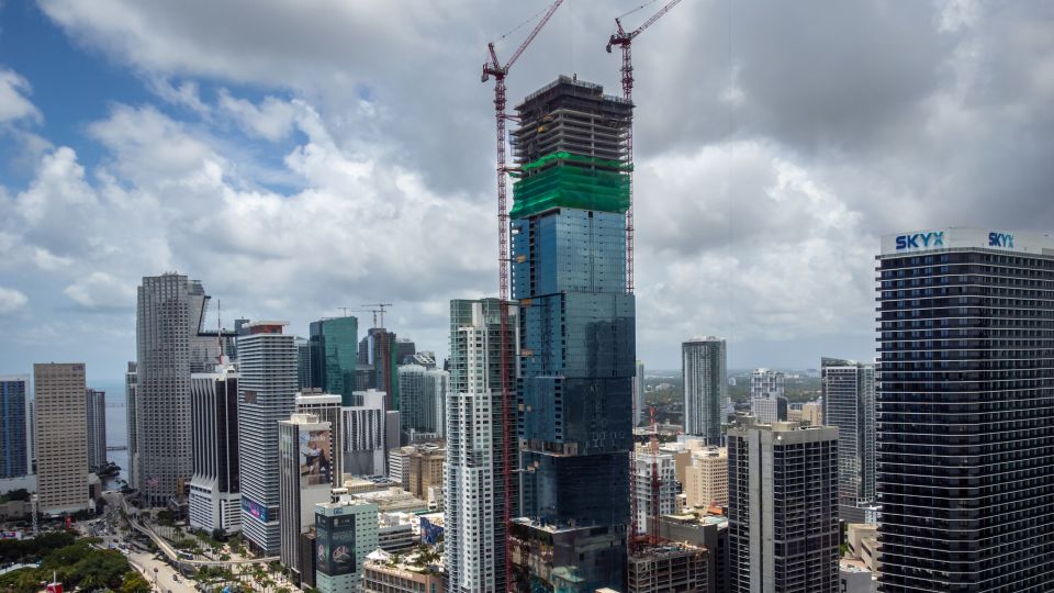 The Waldorf Astoria Miami, designed by Carlos Ott and Sieger Suarez Architects, will be the city's first supertall at 1,049 feet. It is scheduled to open in 2028. - Zak Bennett/Bloomberg/Getty Images