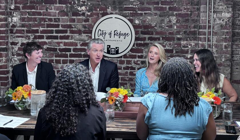 Gov. Gavin Newsom and First Partner Jennifer Siebel Newsom at an event to sign an executive order.