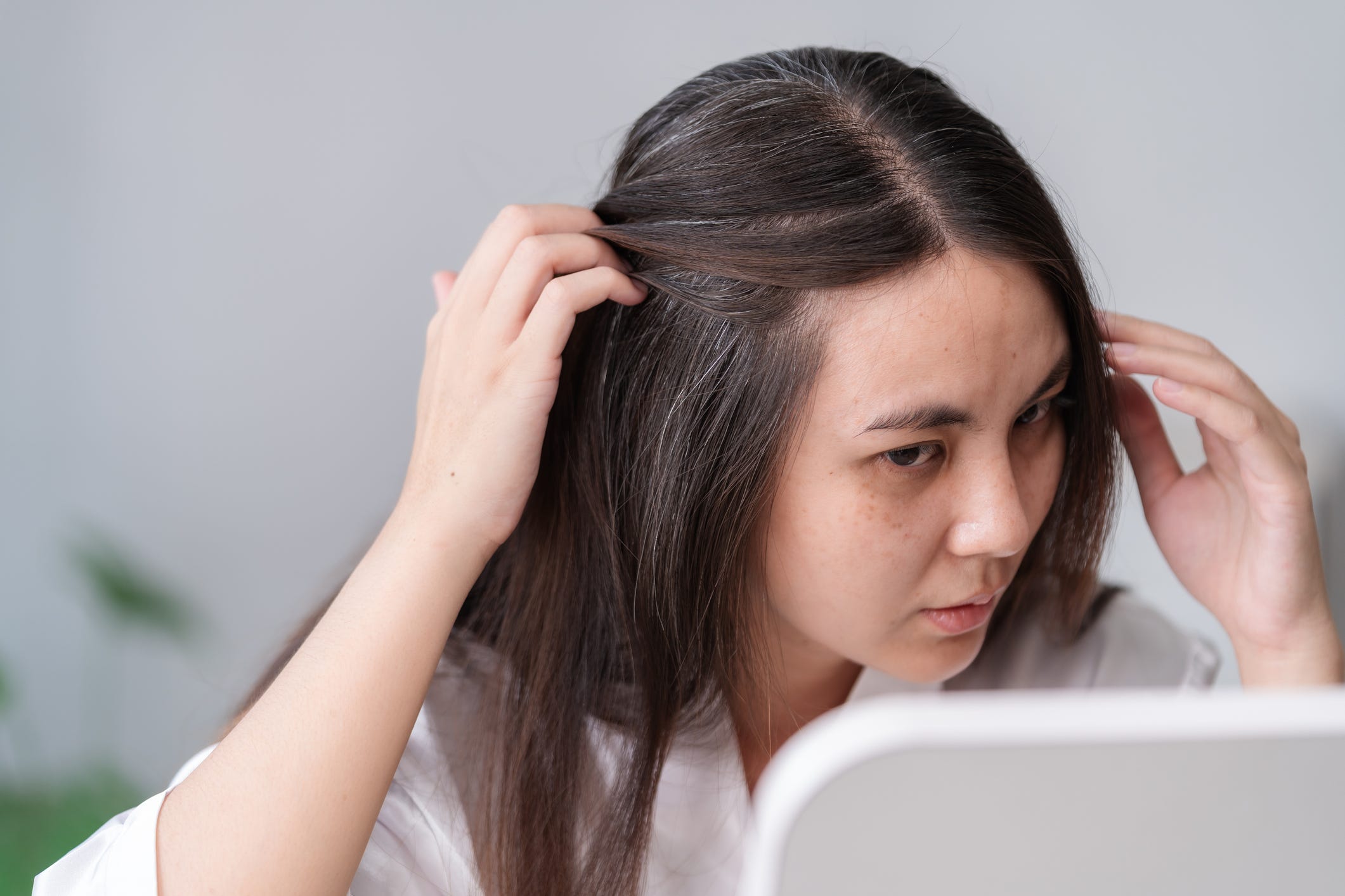 The age a person goes gray is largely due to their genetics. But experts say there are still some changes you can make to slow this process.
