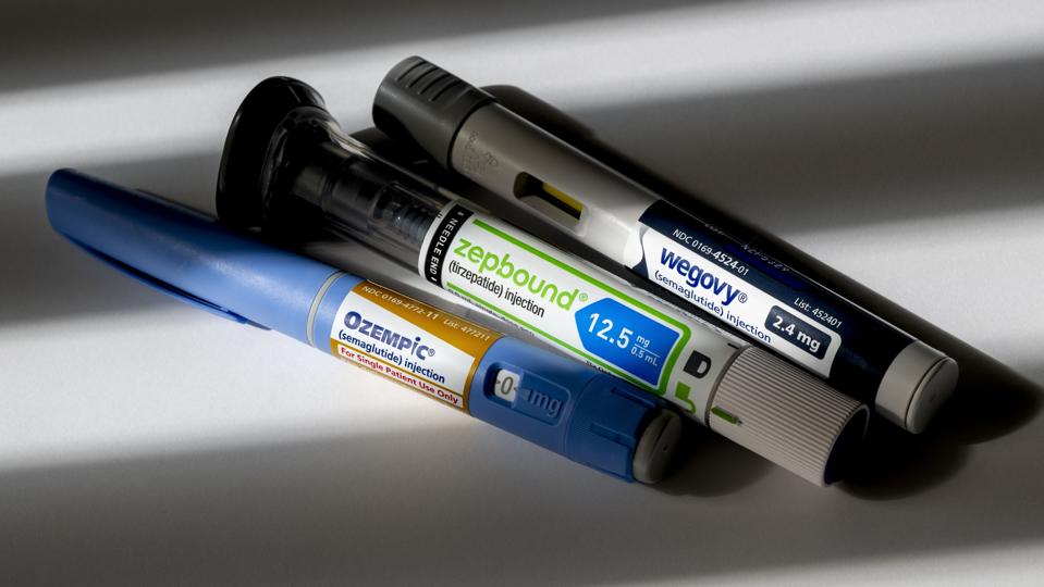 photo illustration of a group of weight loss injection pen medications.