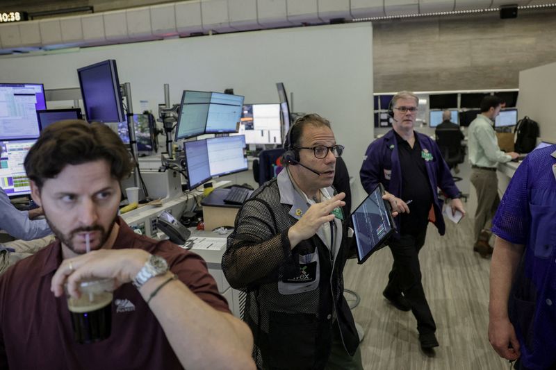 Wall St ends higher on chip stocks recovery; earnings draw focus